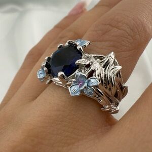 Anthropologie Silver Floral Ring with Deep Blue Stone and Light Blue Accents